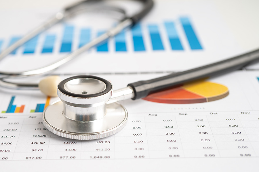 Stethoscope lying on charts