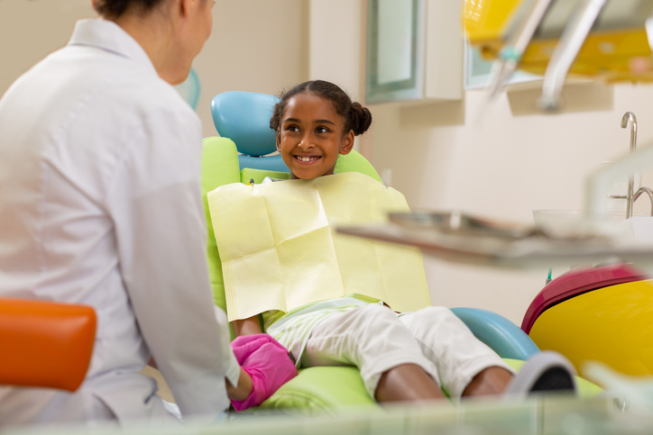 Child being seen by a dental health professional